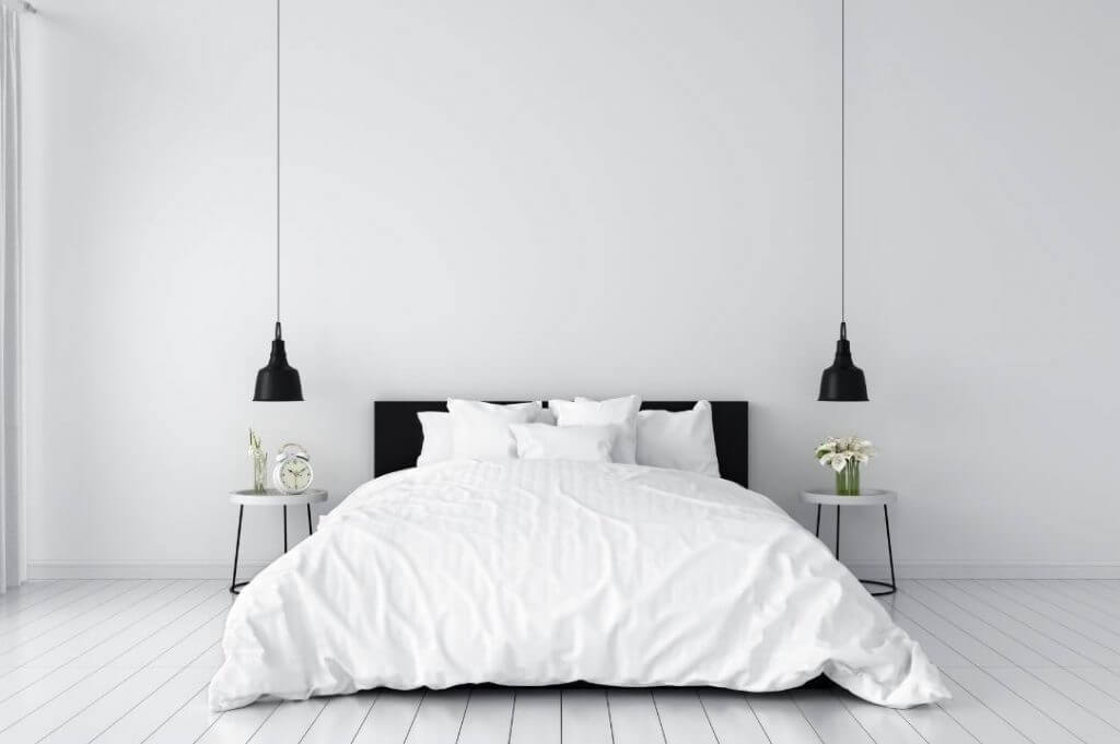 Arredare casa stile minimal: less is more! | Facile Ristrutturare Camera da letto stile minimal con lampadario a sospensione nero.