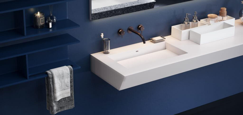 Corian: un materiale all’avanguardia per arredare la tua casa | Facile Ristrutturare lavello corian in bagno con piastrelle blu.