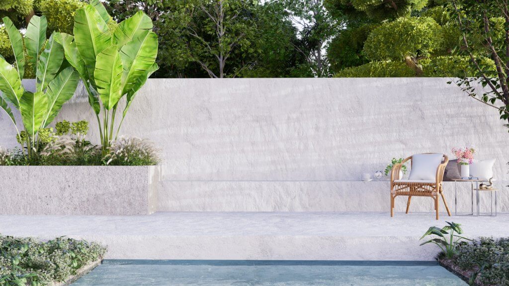 5 Consigli per rinnovare la casa in Primavera | Facile Ristrutturare Spazio outdoor con sedia in legno e parete bianca con piante